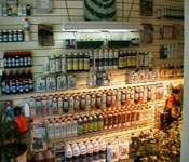 An extensive range of bottles on the left wall of the shop. Larger quantities are on the other side.